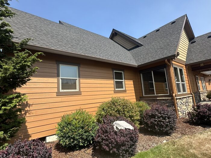 Craftsman home side exterior with bay window after professional repaint