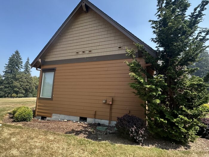 Craftsman home gable end exterior after repaint, clean siding lines
