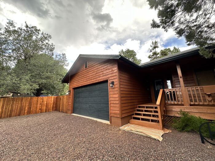 Wood fence and garage exterior after stain and paint, Clark County WA