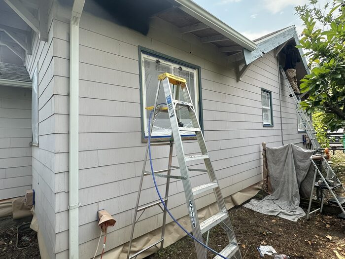 Window masking and surface prep before exterior painting in Vancouver WA